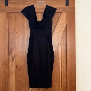 New with tags, deadly dames sexy wiggle dress.